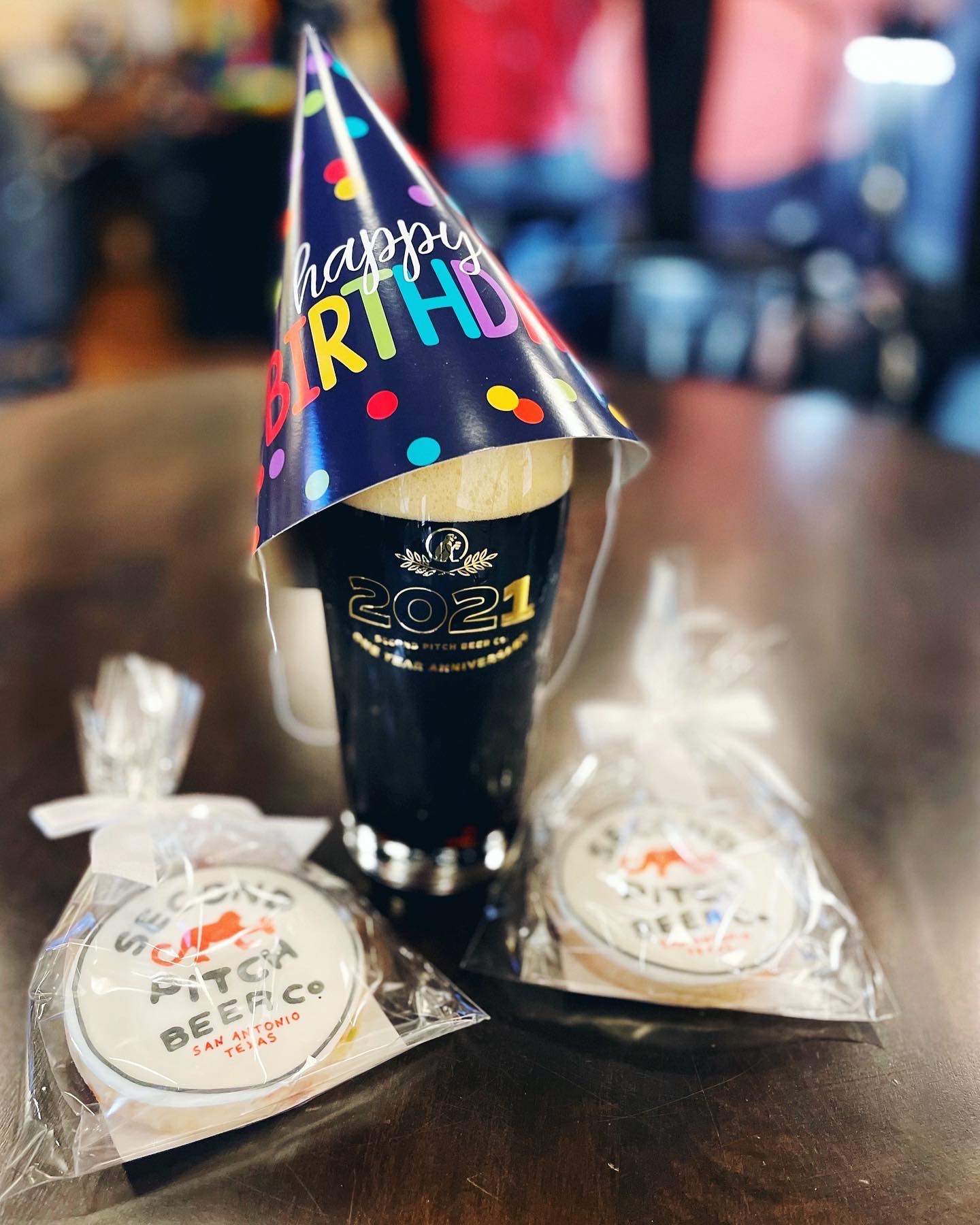 Beer wearing a birthday party hat